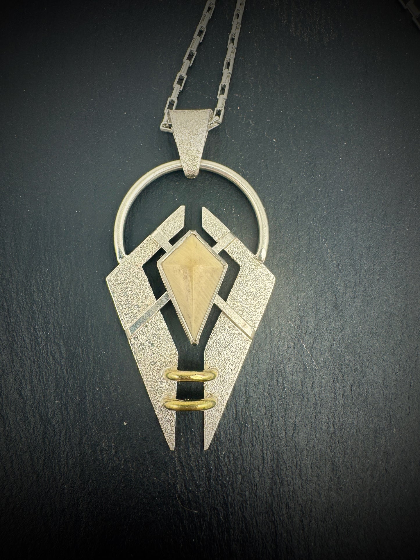 Unchained Mammoth Ivory pendant spaceship