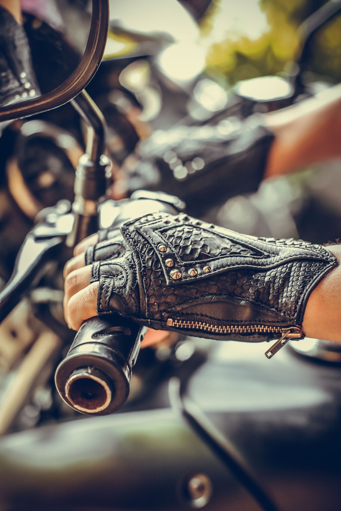 black leather DragonScale gloves on motorcycle- anahata designs fingerless leather python gloves perfect for burning man or cosplay